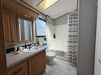 NEW LISTING!! SITE #64- 2002 NORTHLANDER MEADOWBROOK- 14'x39'- 1 BED WITH LARGE SUNROOM
