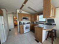 NEW LISTING!! SITE #64- 2002 NORTHLANDER MEADOWBROOK- 14'x39'- 1 BED WITH LARGE SUNROOM